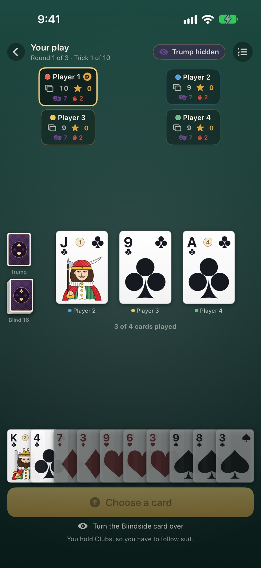 A trick in progress against three computer opponents: a jack, nine and ace of clubs on the table, the face down trump card on the left, and a hand of ten cards along the bottom